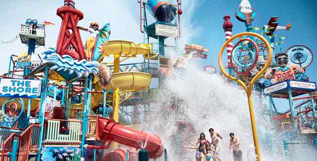 Two girls floating in lazy river at The Boardwalk At Hersheypark