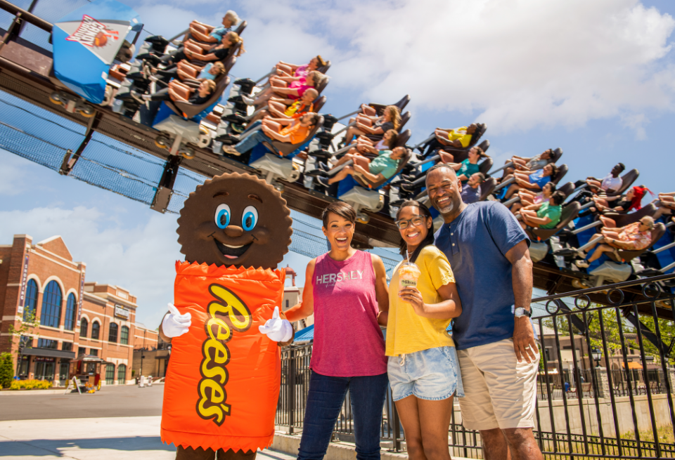 Family in front of coaster at Hersheypark