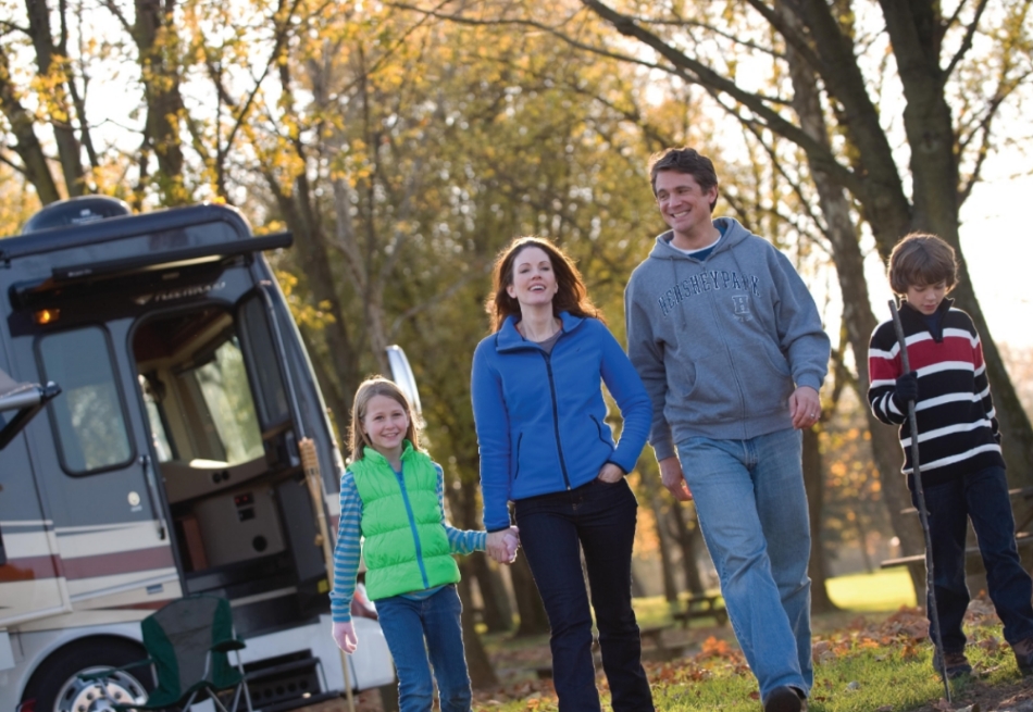 A family walking around campsite